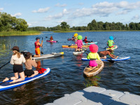 Dagdas ezarā notika pirmais SUP festivāls